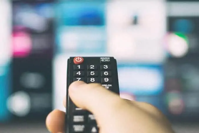 Remote control pointing at a TV with Programmatic Media Advertising