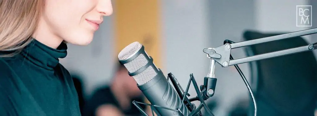 woman speaking on studio microphone